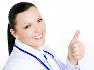 smiling brunette female doctor show thumb up sign