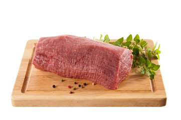Raw beef on cutting board isolated on white background