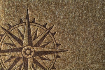 Compass rose on wood texture