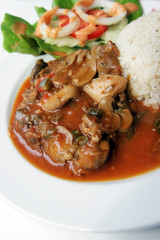 Spicy herb chicken and mushroom serve with rice and salad