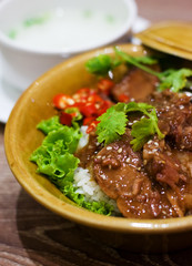 Spicy chinese beef stew with chili , rice and soup