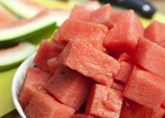 Closeup bowl of watermelon on a bench
