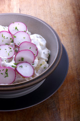 potato salad with mayonnaise and radish in a bowl