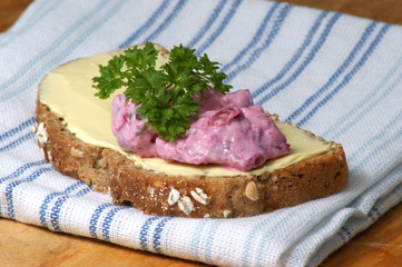 red organic herring salad on soda bread
