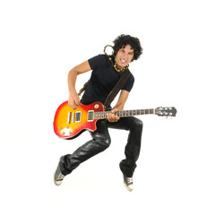 Young guitarist jumping isolated