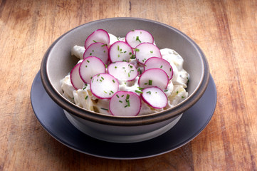 potato salad with mayonnaise and radish in a bowl