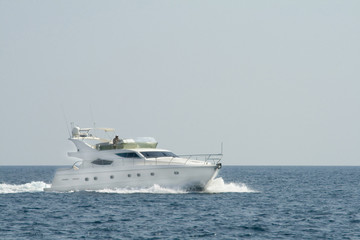 Fototapeta na wymiar Luxury white yacht in the blue ocean