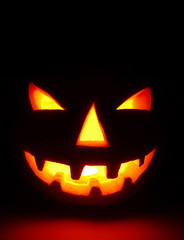 Halloween pumpkin on black (jack-o’-lantern)
