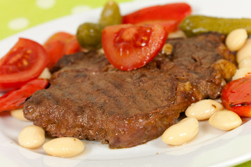Schweine - steak mit Bohnen,Pprika