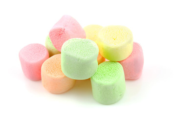 Stacked colorful marhsmallows over white background