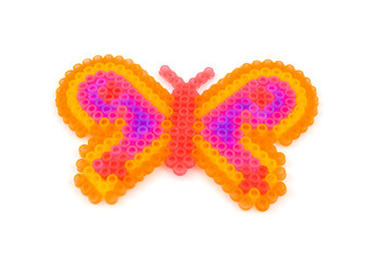 Beads art in the shape of butterfly over white backround