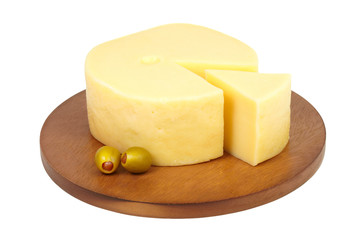 Big chunk of cheese with green olives.
