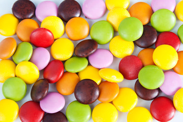 Many colourful halloween candy filling background.