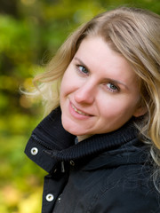 Naklejka premium portrait of Beautiful romantic blonde in the autumn park