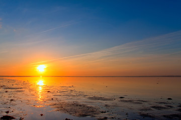 Sunrise at the sea coastline