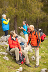 four hikers focus on couple in front