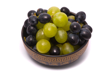 Green and blue grapes on a studio white background