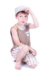 Cute blue-eyed boy with retro cap  posing