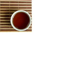 A part of bamboo mat with the Japanese teacup