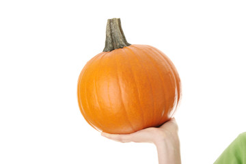 Young woman holding orange pumpkin
