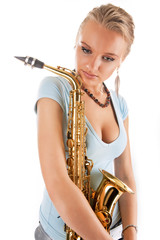 dreaming young pretty blonde girl with saxophone isolated