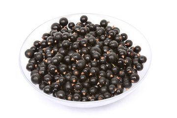 Fresh black currant in a glass bowl