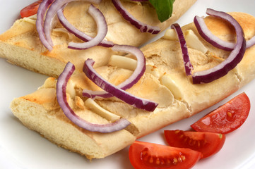 baguette as a snack with onion and tomato