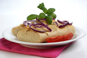 baguette as a snack with onion and tomato