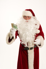 Weihnachten,Weihnachtsmann mit Geld in der Hand