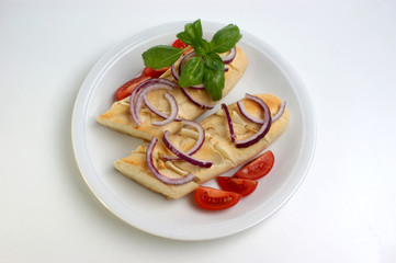 baguette as a snack with onion and tomato