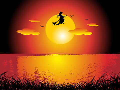 witch flying on sunset background