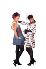 Two Fashion girls posing on white background