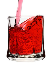 Red wine is being poured into glass