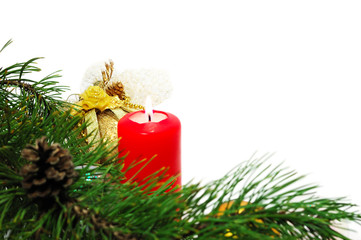 Christmas decoration with a pine branch, candle and balls