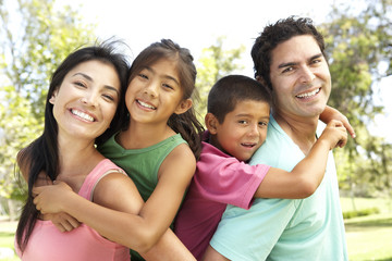 Fototapeta premium Young Family Having Fun In Park
