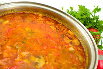 Vegetable soup with mushrooms, parsley and pepper.
