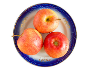 Fresh apples on the plate (isolated on white)