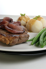 grilled rump steak and bacon with organic vegetable