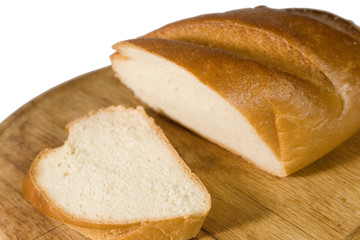 Closeup of a cut baguette on a wooden plate