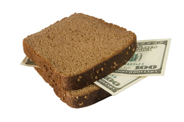One-hundred dollar bills between two slices of brown bread