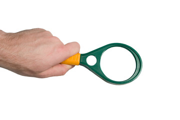 Hand holding a magnifying glass (isolated on white)