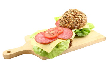 two sandwiches on cutting board