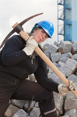 Female worker with pickaxe