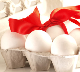 Egg in box with red bow