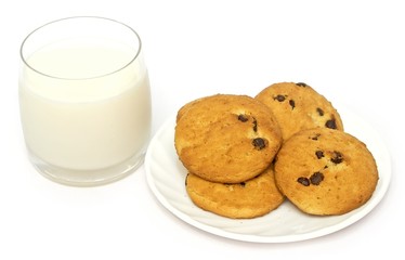 glass of milk and cookies on a plate isolated on white