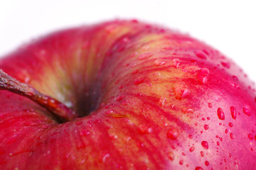 Red apple with water drops.