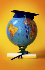 World globe with graduation cap and diploma
