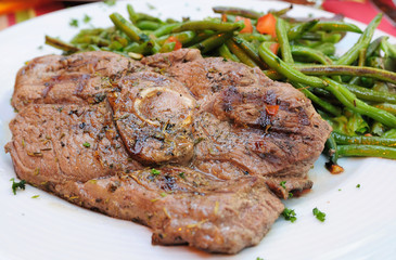 porterhouse juicy steak with fresh green beans