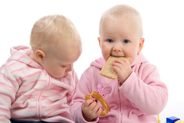 Little girl eating a cracker