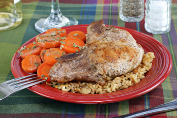 Pork chop, rice and carrot dinner.